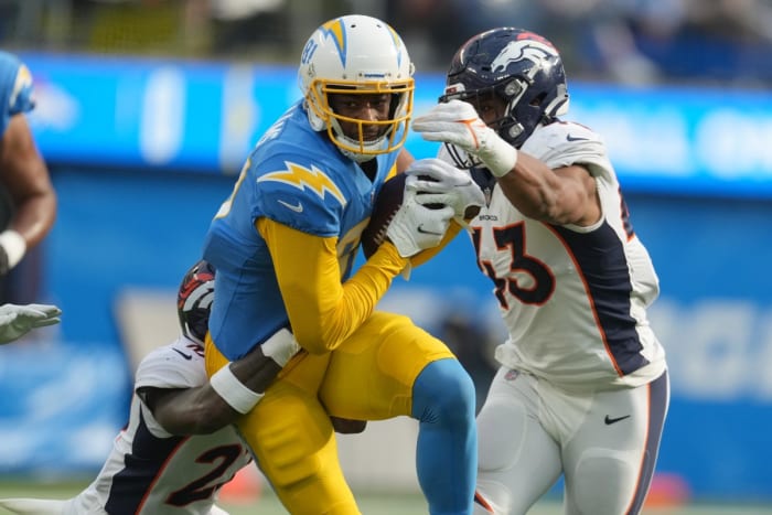 Jan 2, 2022; Inglewood, California, USA; Los Angeles Chargers wide receiver Mike Williams (81) is defended by Denver Broncos cornerback Pat Surtain II (2) and inside linebacker Micah Kiser (43) in the first half at SoFi Stadium. Mandatory Credit: Kirby Lee-USA TODAY Sports